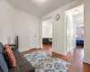 Living room with wood-type flooring and baseboards