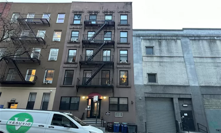 View of building exterior featuring central air condition unit