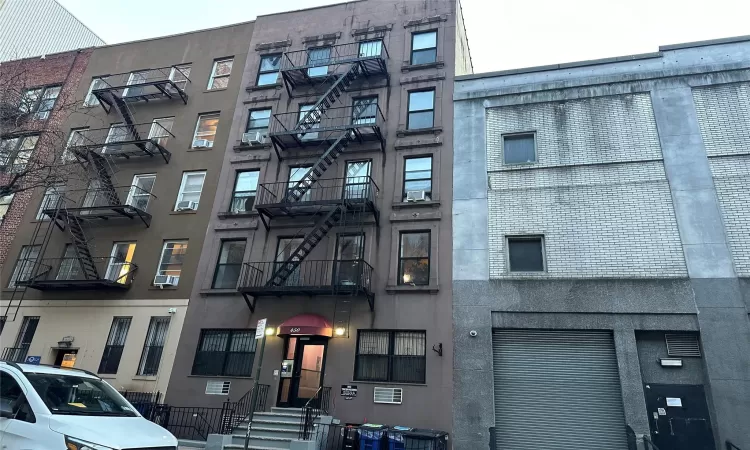 View of property with cooling unit and central AC