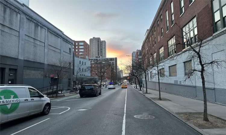 View of street with sidewalks, street lights, and curbs