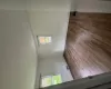 Spare room featuring visible vents, baseboards, and wood finished floors