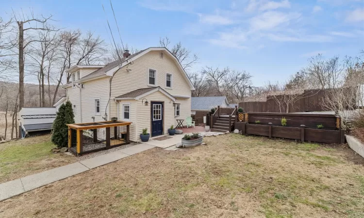 Welcome to 53 Dogwood Road.  This colonial home has a farmhouse flair.