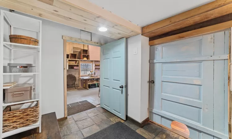 Small foyer with access to the barn on lower level.