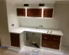 Laundry room featuring ornamental molding and baseboards