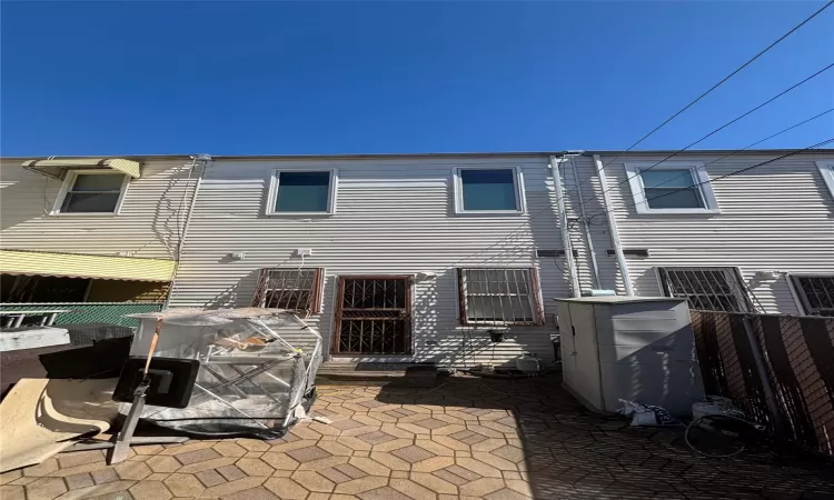 Back of property featuring a patio area and fence