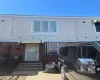 View of front of house featuring entry steps and brick siding