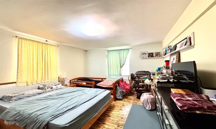 Bedroom with wood finished floors