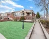 View of front of property with a front lawn and brick siding