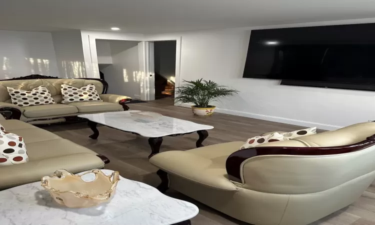 Living room featuring baseboards and wood finished floors