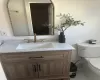 Half bath with vanity and toilet