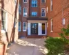 Property entrance featuring brick siding