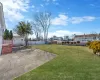 View of yard featuring a fenced backyard and a patio