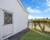 View of yard featuring fence and a gate