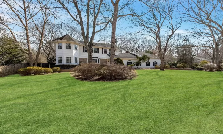 View of yard featuring fence