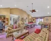 Carpeted living room featuring recessed lighting, stairs, visible vents, and pool table