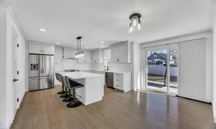 Other area with recessed lighting, wood finished floors, and baseboards