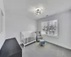 Bedroom featuring light colored carpet, visible vents, and baseboards