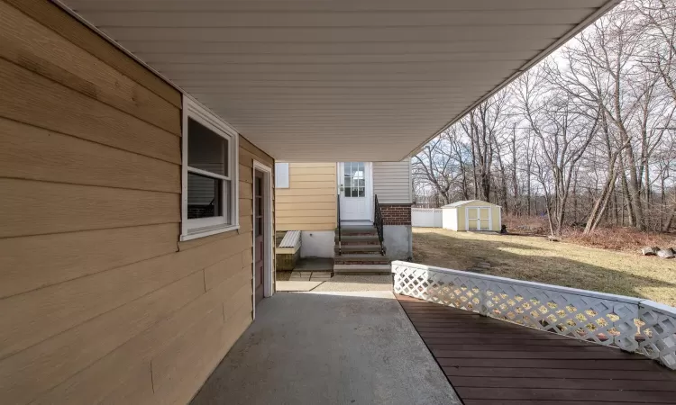 View of yard with fence and a wooden deck