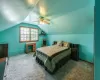 Sitting room with wood walls, wood-type flooring, baseboards, and ceiling fan