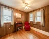 Bedroom with crown molding, a closet, a ceiling fan, and wood finished floors