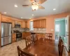 Kitchen featuring tasteful backsplash, stainless steel appliances, stone counters, a sink, and recessed lighting