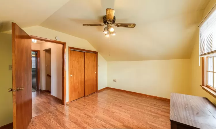 Bathroom with toilet, a wealth of natural light, and vanity