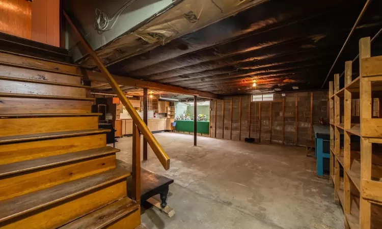 Bonus room featuring lofted ceiling, ceiling fan, wood finished floors, and baseboards