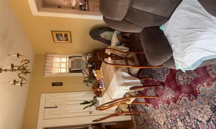 Dining area featuring cooling unit and a chandelier