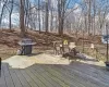 Deck with a grill and outdoor dining space