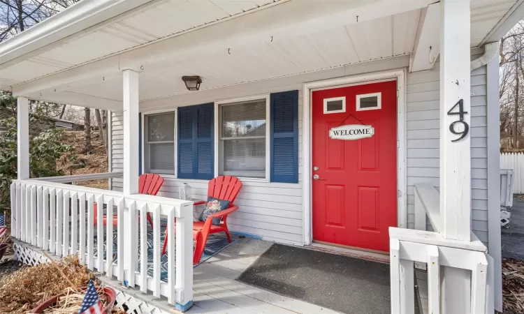 Property entrance with covered porch