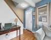 Foyer with light wood finished floors, baseboards, and baseboard heating