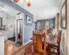 Dining space with light wood finished floors, ceiling fan, baseboards, and a baseboard radiator