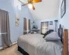 Bedroom with high vaulted ceiling, a baseboard radiator, carpet floors, and ceiling fan