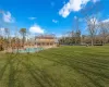 View of yard featuring a fenced in pool and fence