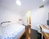 Bedroom with visible vents, baseboards, a closet, and dark wood finished floors