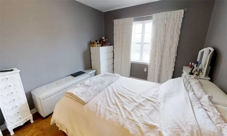 Bedroom featuring wood finished floors