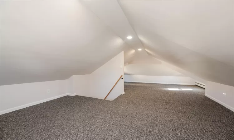 Bonus room with baseboards, carpet floors, recessed lighting, vaulted ceiling, and a baseboard heating unit