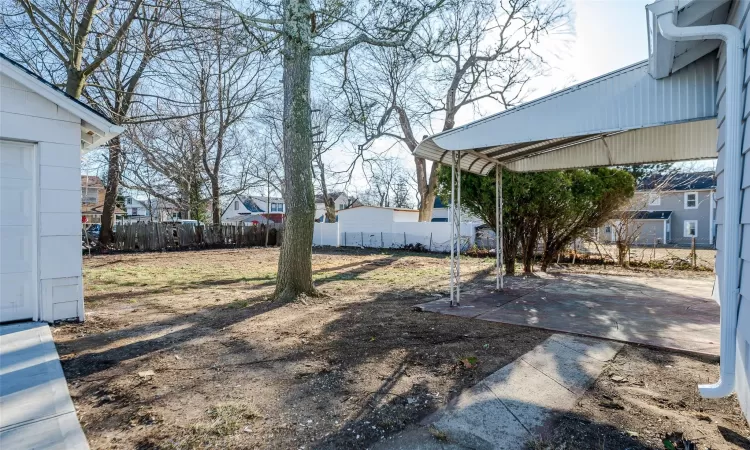 View of yard featuring a patio area and fence