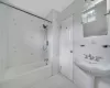 Full bathroom featuring tub / shower combination, tile walls, and tile patterned flooring