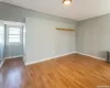 Empty room featuring baseboards and light wood finished floors