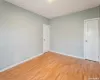 Unfurnished room with baseboards and light wood-style floors