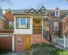 Multi unit property featuring brick siding, a garage, and fence