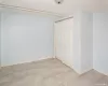 Unfurnished bedroom with baseboards and a closet