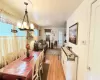 Dining room with a notable chandelier and light wood finished floors