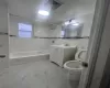 Full bath with vanity, visible vents, tub / shower combination, toilet, and marble finish floor