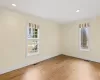 Empty room with visible vents, baseboards, and light wood-style floors