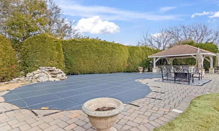 View of pool featuring a gazebo and a patio