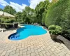 Outdoor pool with a patio