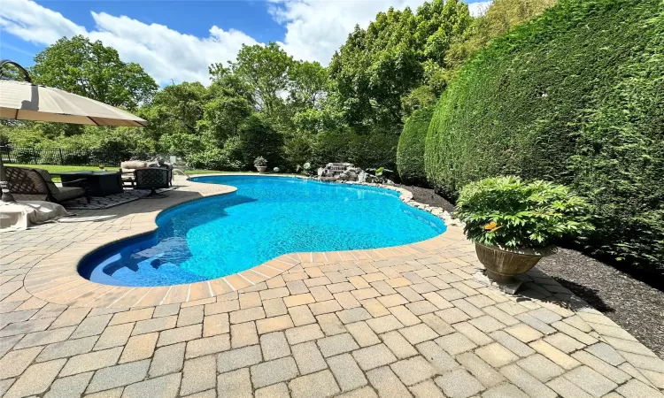 Outdoor pool with a patio