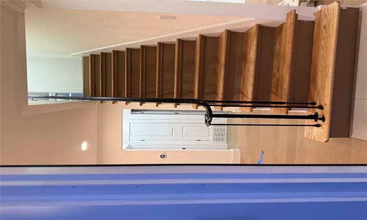 Staircase featuring visible vents, recessed lighting, baseboards, and wood finished floors